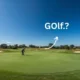 Golfer preparing to tee off on a scenic green golf course with a clear blue sky.
